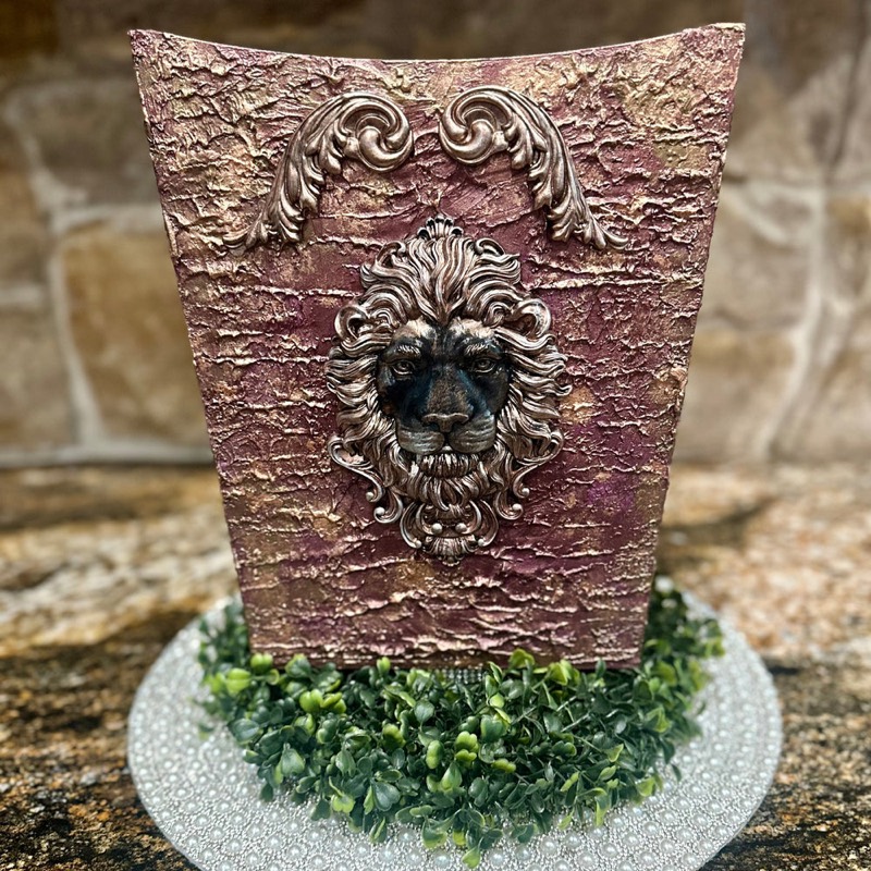 Textured rose-gold trash bin with sculpted lion head
